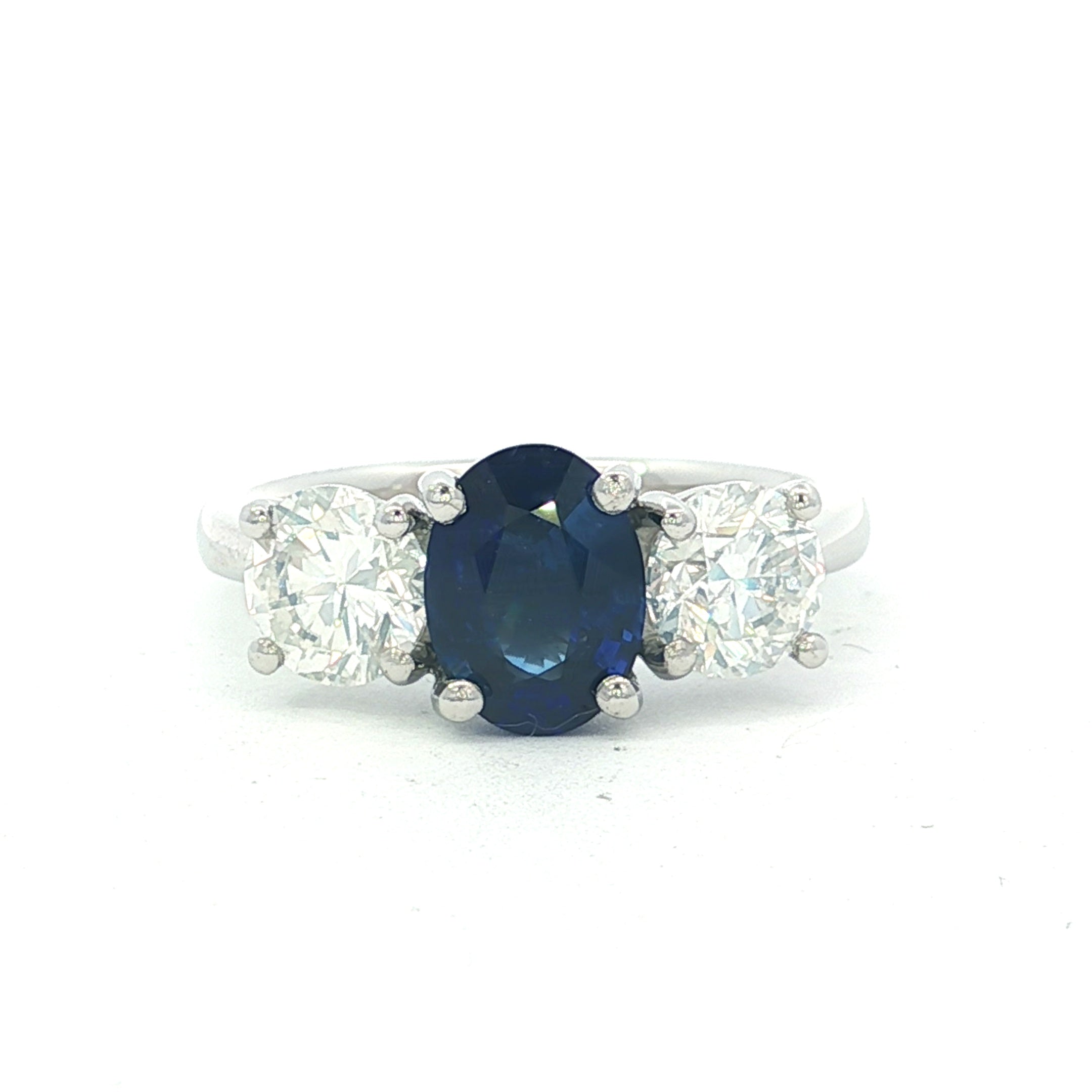 Platinum Oval Cut Sapphire & Brilliant Cut Diamond Ring